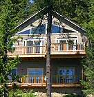 The Lake House on Hayden rests right on the lake, with 2100 square feet of living space, multiple view decks, a large private dock, and all the comforts of a 5-star hotel! Hayden Lake House Vacation House Rental, Hayden Lake, Idaho